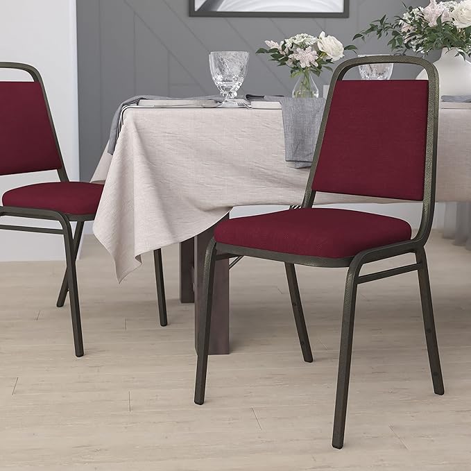 EMMA + OLIVER Trapezoidal Back Fabric Upholstered Stackable Banquet Chair, Multipurpose Stacking Chair with Padded Seat and Back, Burgundy/Gold