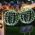 Solar Powered Hanging Iron Sphere Lights with Artificial Greenery – 12Inch 120 LED Waterproof Outdoor Decor Ball Light with Timer & 8 Modes – 2 Pack for Garden, Christmas, Weddings (Cool White)