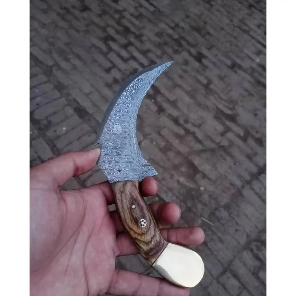 Damascus karambit knife..