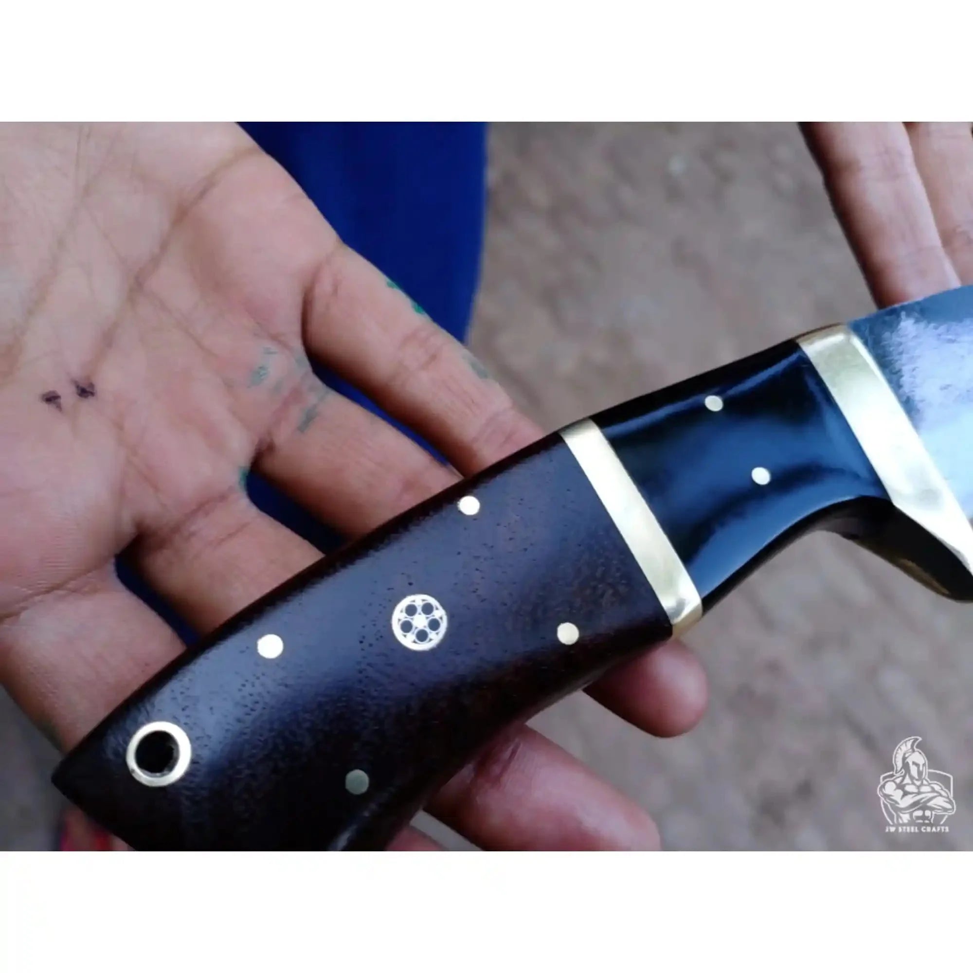 Gut hook knife with wood and brass handle.
